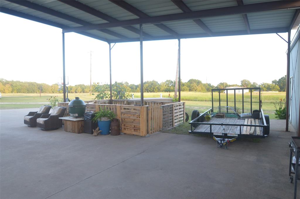 261 Red Road Howe, TX 75459 - Photo 10 of 37 a building outdoor space with furniture
