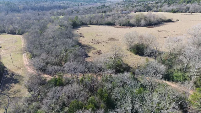a view of a dry yard covered with snow