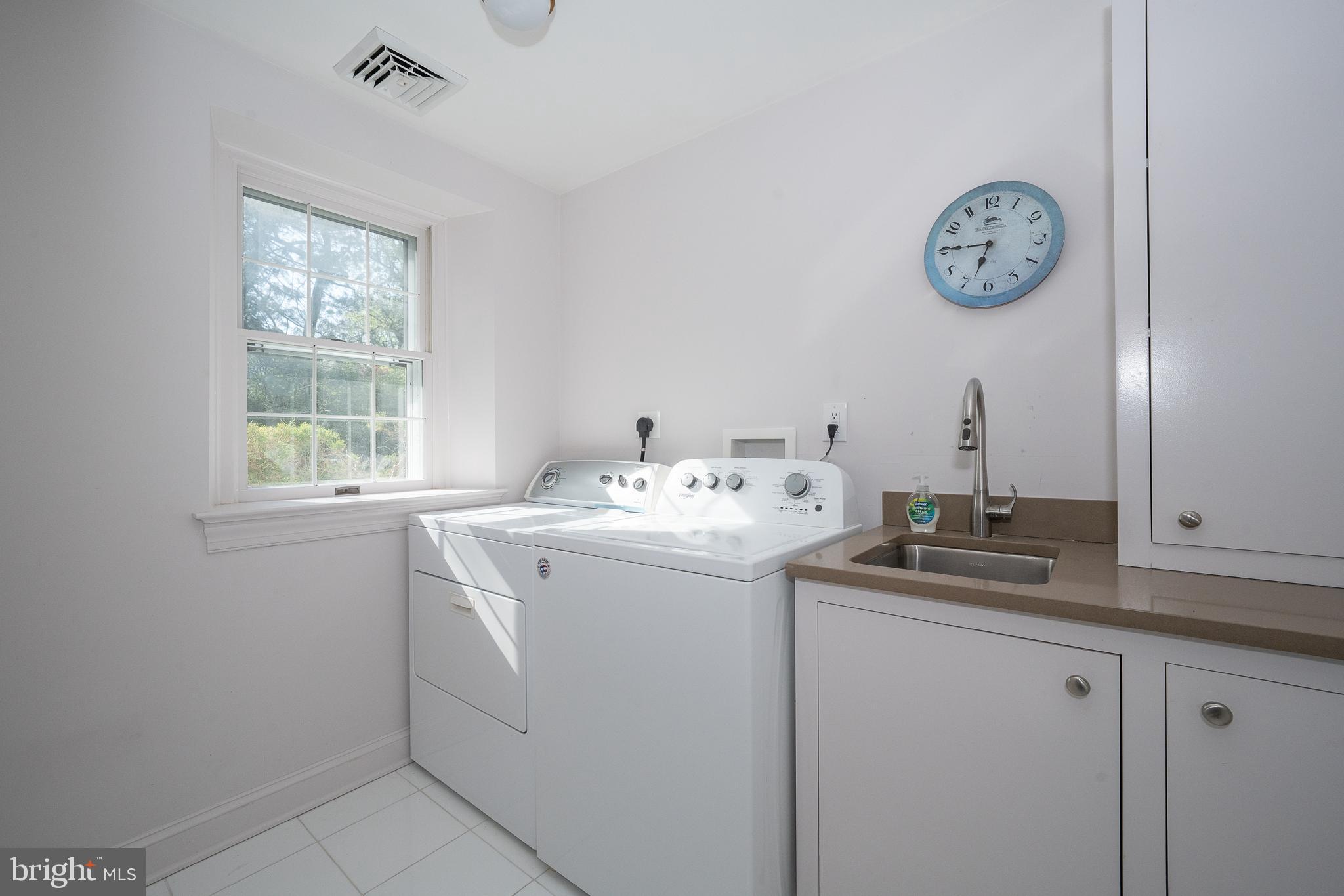 510 Lynmere Road Bryn Mawr, PA 19010 - Photo 24 of 44 a utility room with closet and a clock