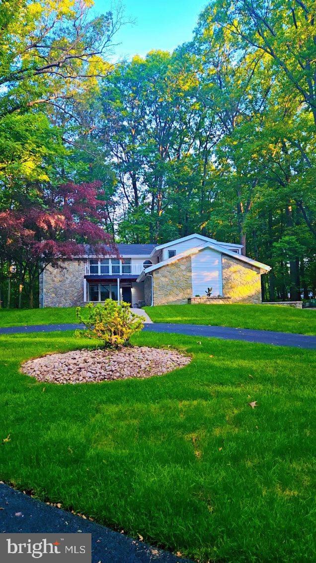 555 Hilltop Road Hummelstown, PA 17036 - Photo 1 of 56 a front view of house with yard and trees in the background