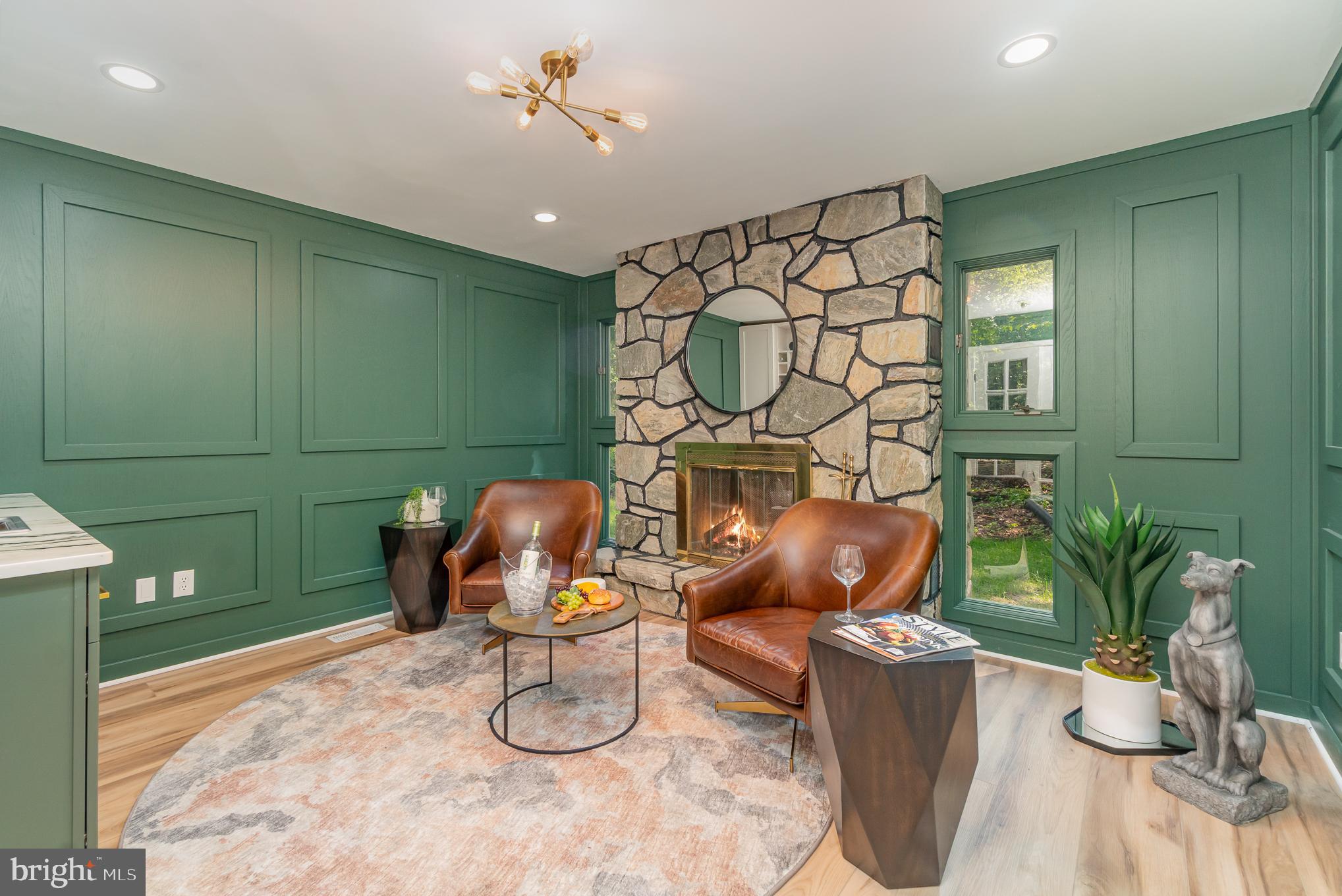 555 Hilltop Road Hummelstown, PA 17036 - Photo 17 of 56 a living room with couches chairs and a potted plant