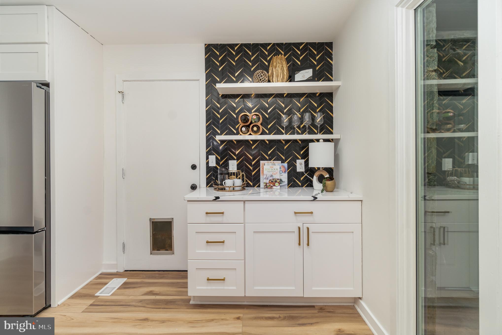 555 Hilltop Road Hummelstown, PA 17036 - Photo 19 of 56 a kitchen with white cabinets and a wooden floor