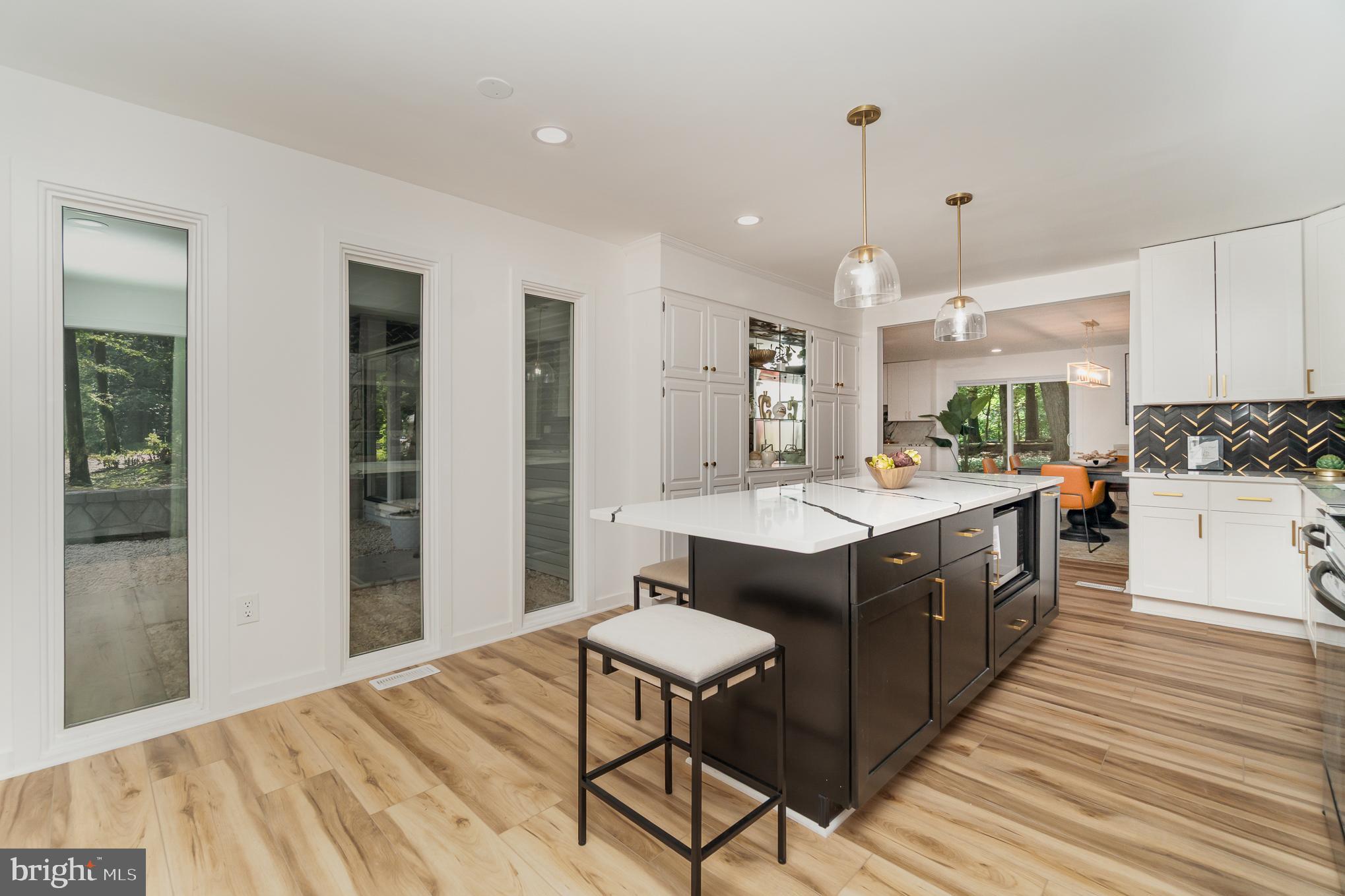 555 Hilltop Road Hummelstown, PA 17036 - Photo 20 of 56 a kitchen with a cabinets and chairs