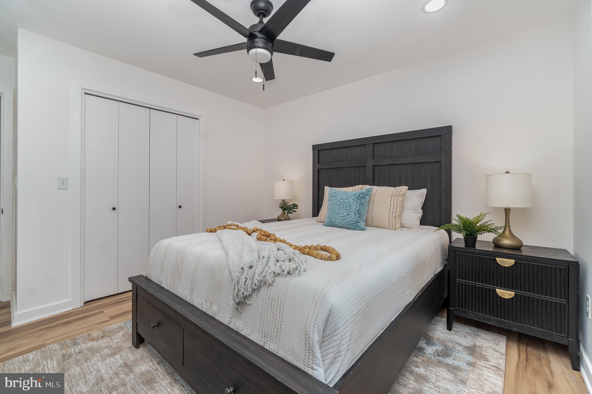 555 Hilltop Road Hummelstown, PA 17036 - Photo 40 of 56 a bedroom with a bed and a ceiling fan