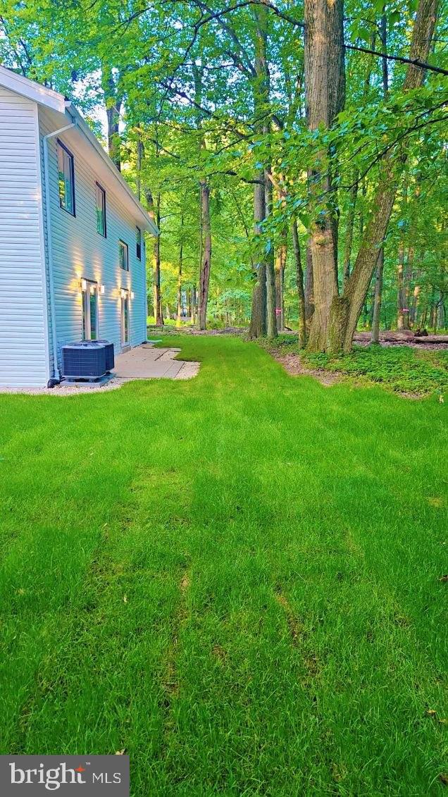 555 Hilltop Road Hummelstown, PA 17036 - Photo 4 of 56 a view of an house with backyard space and garden