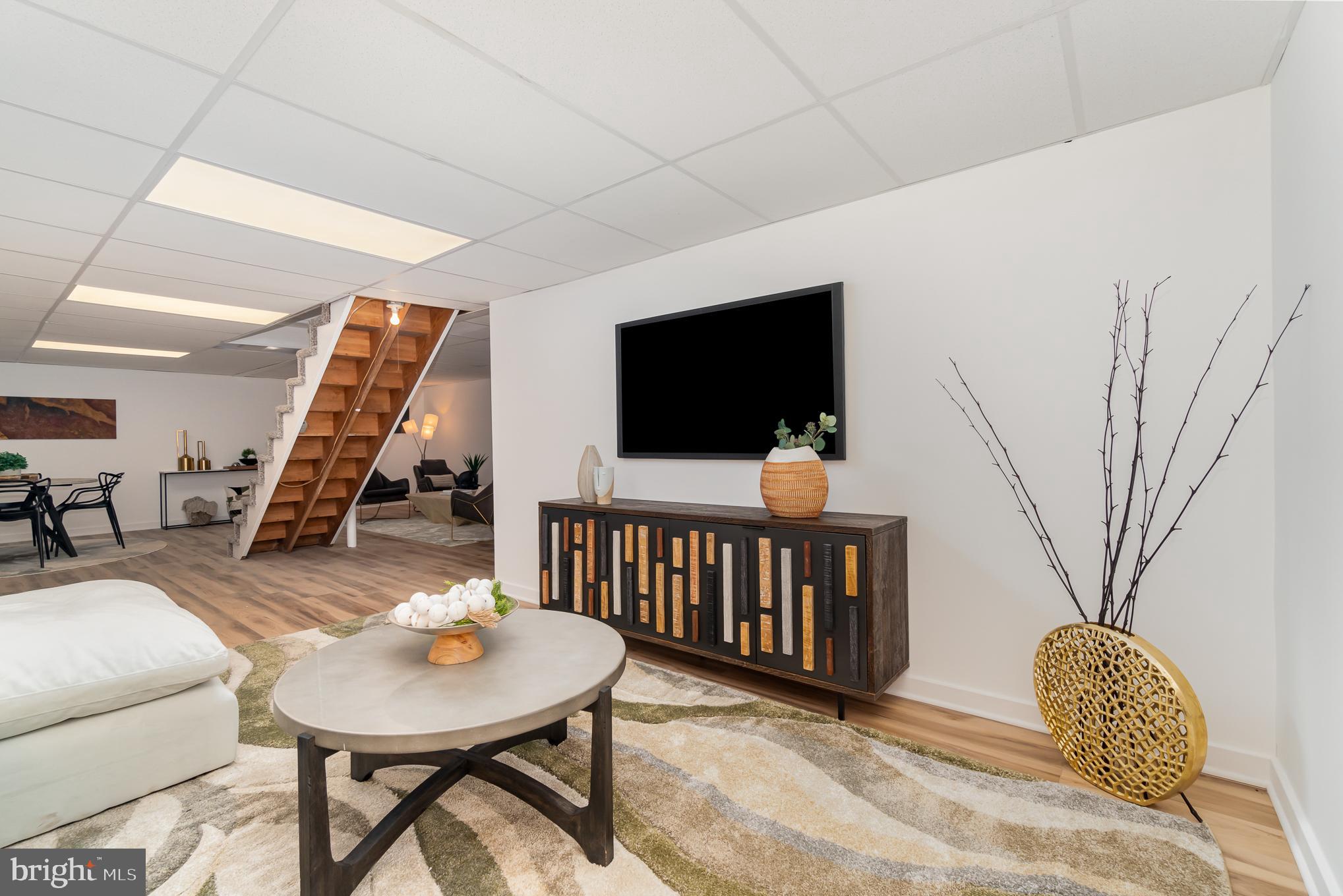 555 Hilltop Road Hummelstown, PA 17036 - Photo 45 of 56 a view of a livingroom with furniture and a flat screen tv
