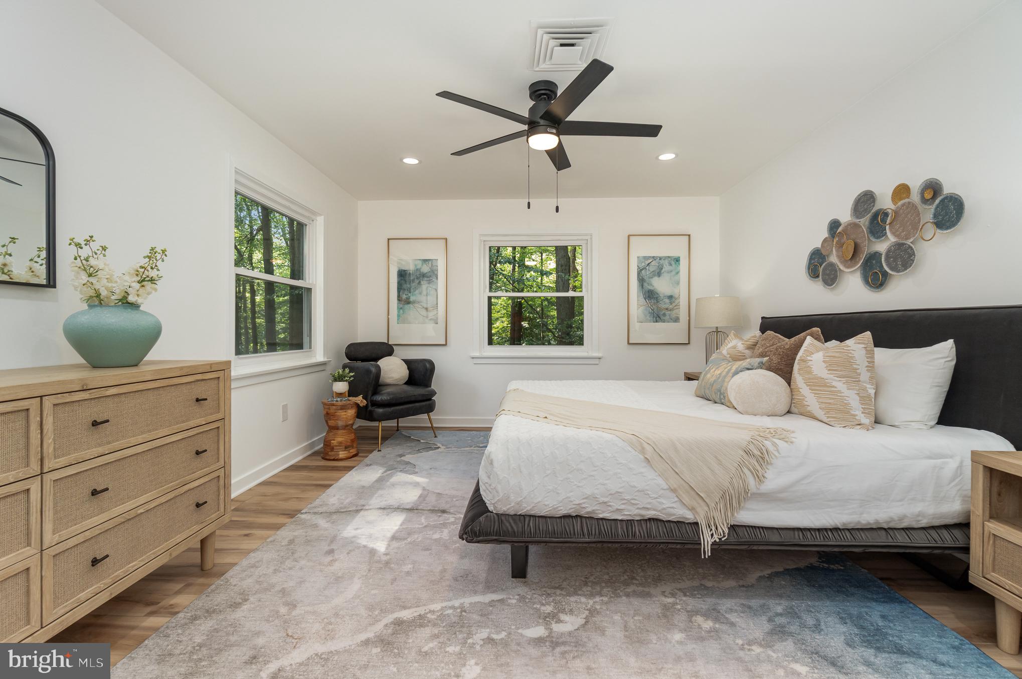 555 Hilltop Road Hummelstown, PA 17036 - Photo 49 of 56 a spacious bedroom with a bed a dresser and potted plant