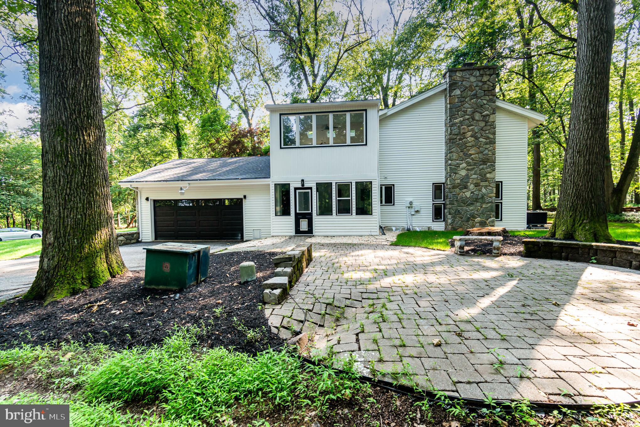 555 Hilltop Road Hummelstown, PA 17036 - Photo 9 of 56 a front view of a house with garden