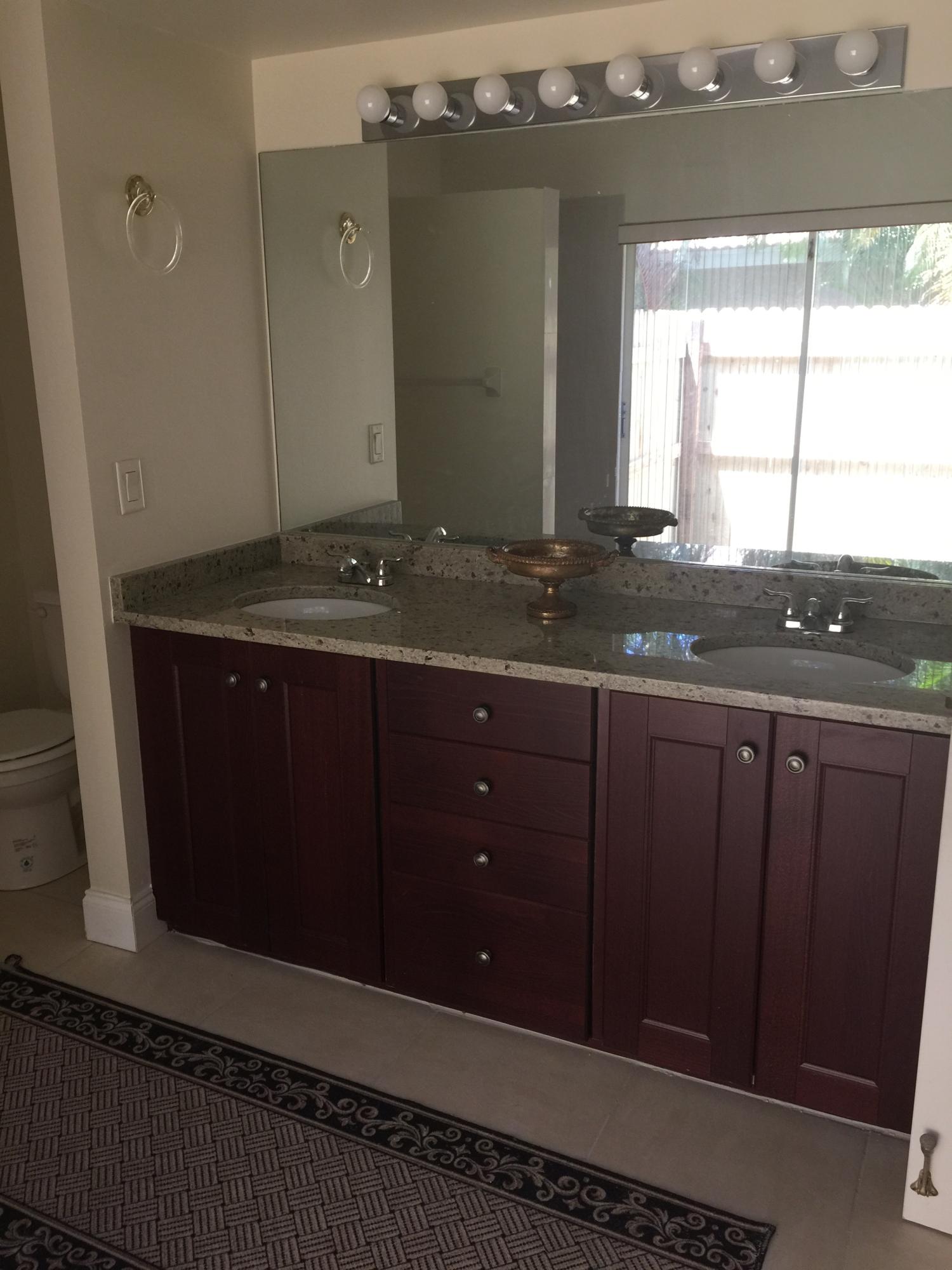 285 Northwest 69th Street Boca Raton, FL 33487 - Photo 25 of 30 granite counters on mahogany cabinets
