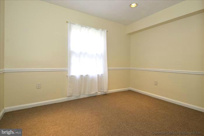 5402 Ridgefield Road Bethesda, MD 20816 - Photo 2 of 27 an empty room with a window