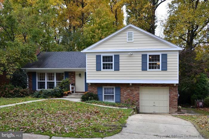 5402 Ridgefield Road Bethesda, MD 20816 - Photo 12 of 27 a front view of a house with a yard