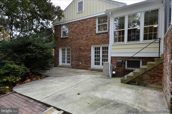 5402 Ridgefield Road Bethesda, MD 20816 - Photo 13 of 27 a view of a house with a yard and garage