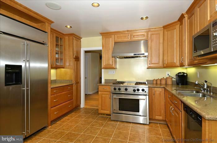 5402 Ridgefield Road Bethesda, MD 20816 - Photo 15 of 27 a kitchen with stainless steel appliances granite countertop a stove a refrigerator and a sink
