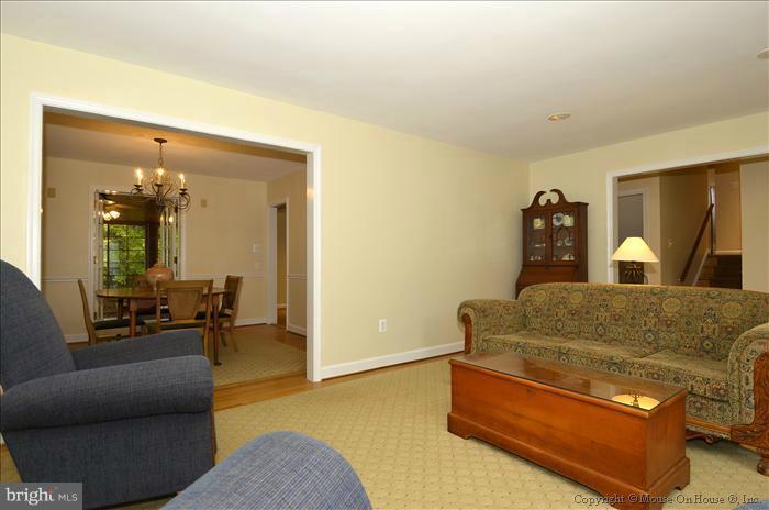 5402 Ridgefield Road Bethesda, MD 20816 - Photo 16 of 27 a living room with furniture and a couch