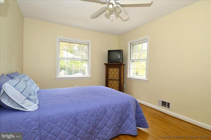 5402 Ridgefield Road Bethesda, MD 20816 - Photo 19 of 27 a bedroom with a bed and a window