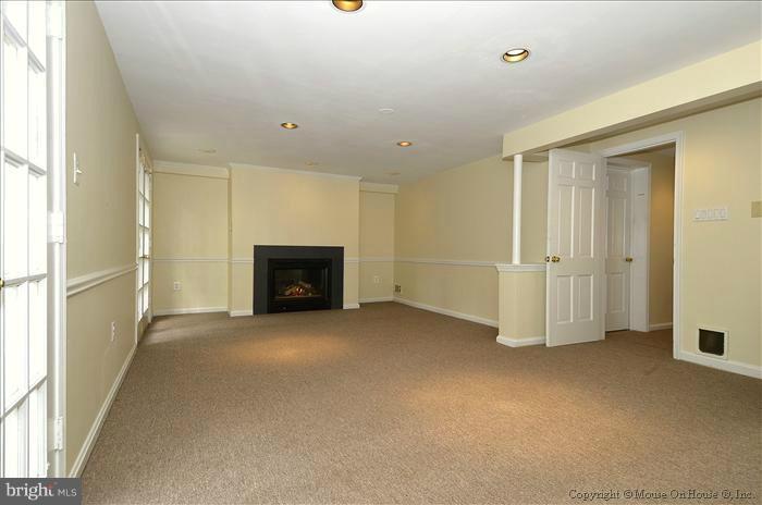 5402 Ridgefield Road Bethesda, MD 20816 - Photo 20 of 27 a view of empty room with a fireplace