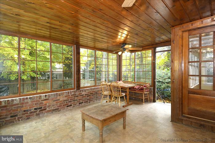 5402 Ridgefield Road Bethesda, MD 20816 - Photo 3 of 27 a living room with furniture and a backyard