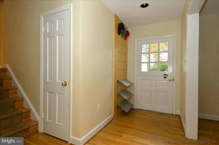 5402 Ridgefield Road Bethesda, MD 20816 - Photo 24 of 27 a view of a hallway with wooden floor and entryway