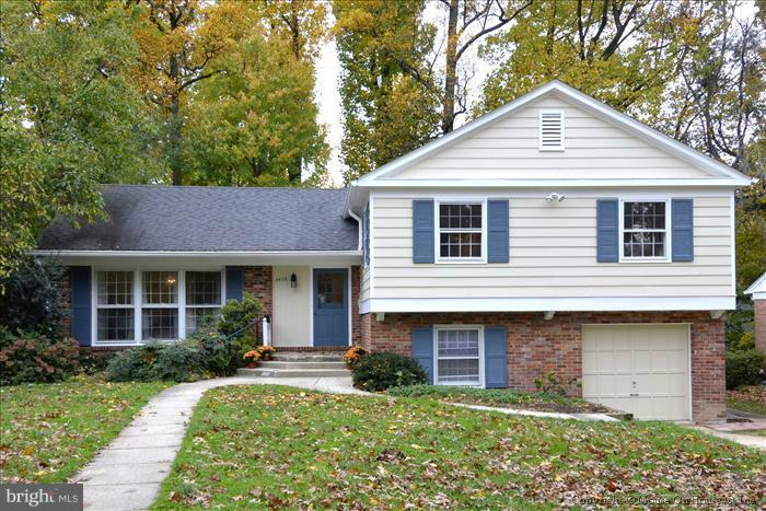 5402 Ridgefield Road Bethesda, MD 20816 - Photo 27 of 27 a front view of a house with a yard and garage