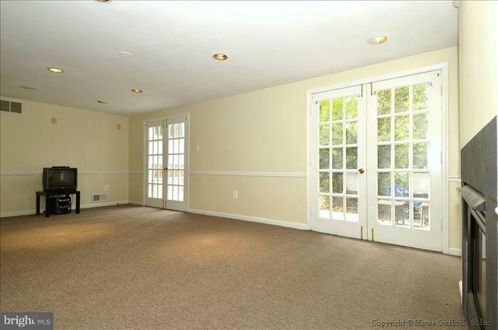 5402 Ridgefield Road Bethesda, MD 20816 - Photo 4 of 27 a view of an empty room with a window