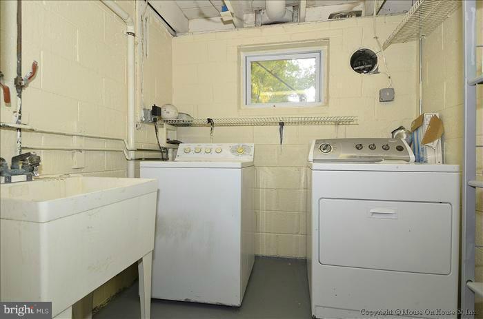 5402 Ridgefield Road Bethesda, MD 20816 - Photo 5 of 27 a utility room with dryer and washer