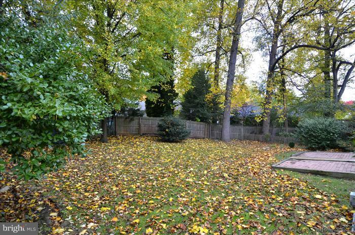 5402 Ridgefield Road Bethesda, MD 20816 - Photo 9 of 27 a backyard of a house with a tree