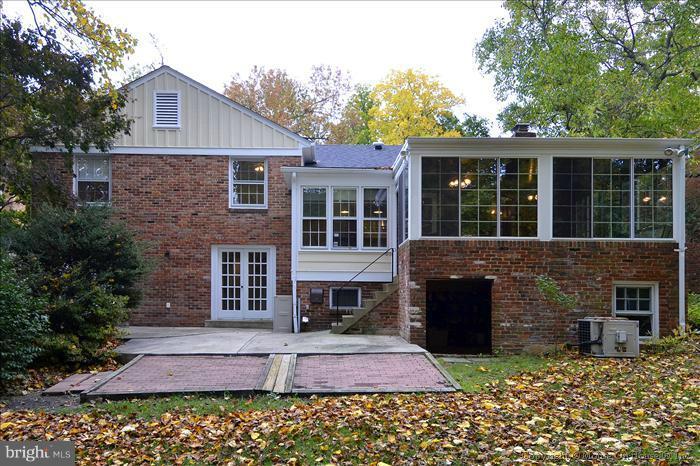 5402 Ridgefield Road Bethesda, MD 20816 - Photo 10 of 27 a front view of a house with a garden