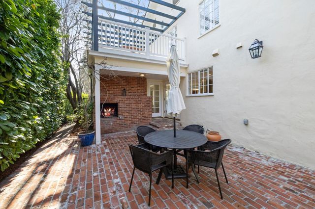 a view of a table and chairs in patio of the house