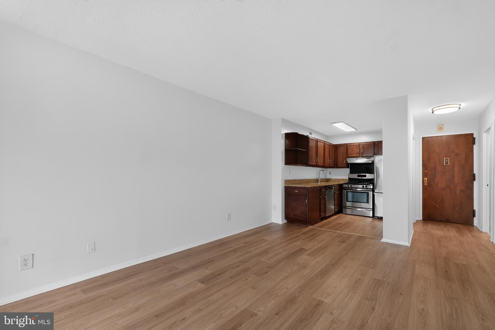 5225 Pooks Hill Road, Unit 1302N Bethesda, MD 20814 - Photo 9 of 19 a view of a kitchen with wooden floor