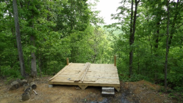 837 Rock Springs Road Celina, TN 38551 - Photo 15 of 28 a wooden bench sitting in the middle of a forest