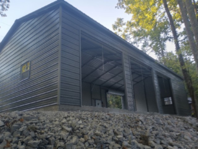 837 Rock Springs Road Celina, TN 38551 - Photo 4 of 28 a backyard of a house with lots of green space