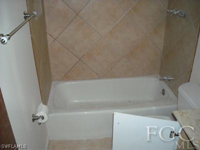 18549 Sunflower Road Fort Myers, FL 33967 - Photo 2 of 5 a bathroom with a bathtub