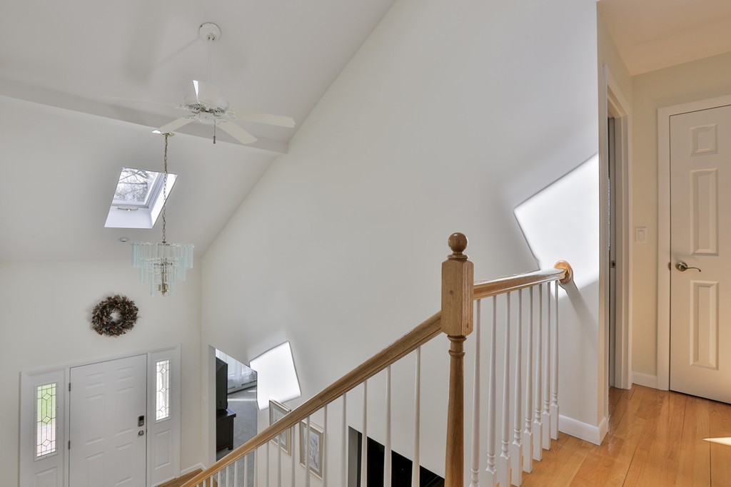 93 Beach Road Salisbury, MA 01952 - Photo 20 of 30 a view of a hallway with wooden floor and staircase