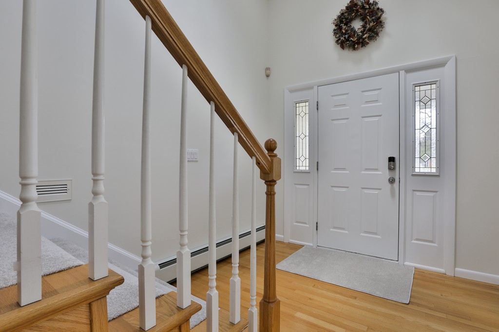 93 Beach Road Salisbury, MA 01952 - Photo 3 of 30 a view of entryway with wooden floor and stairs