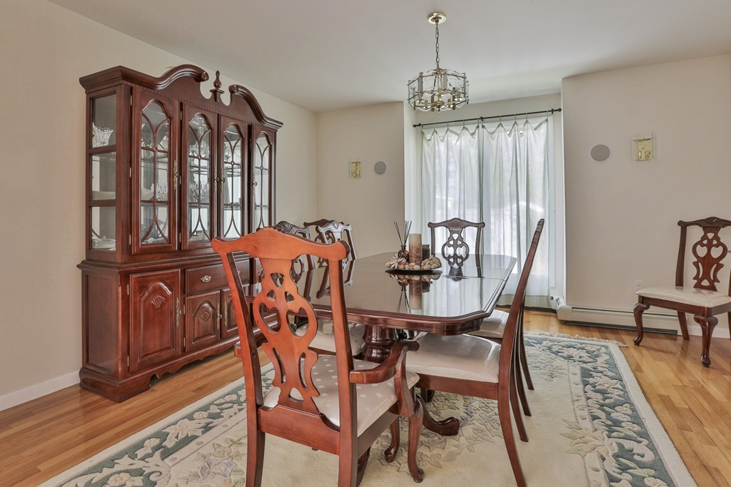 93 Beach Road Salisbury, MA 01952 - Photo 8 of 30 a view of a dining room with furniture window and wooden floor