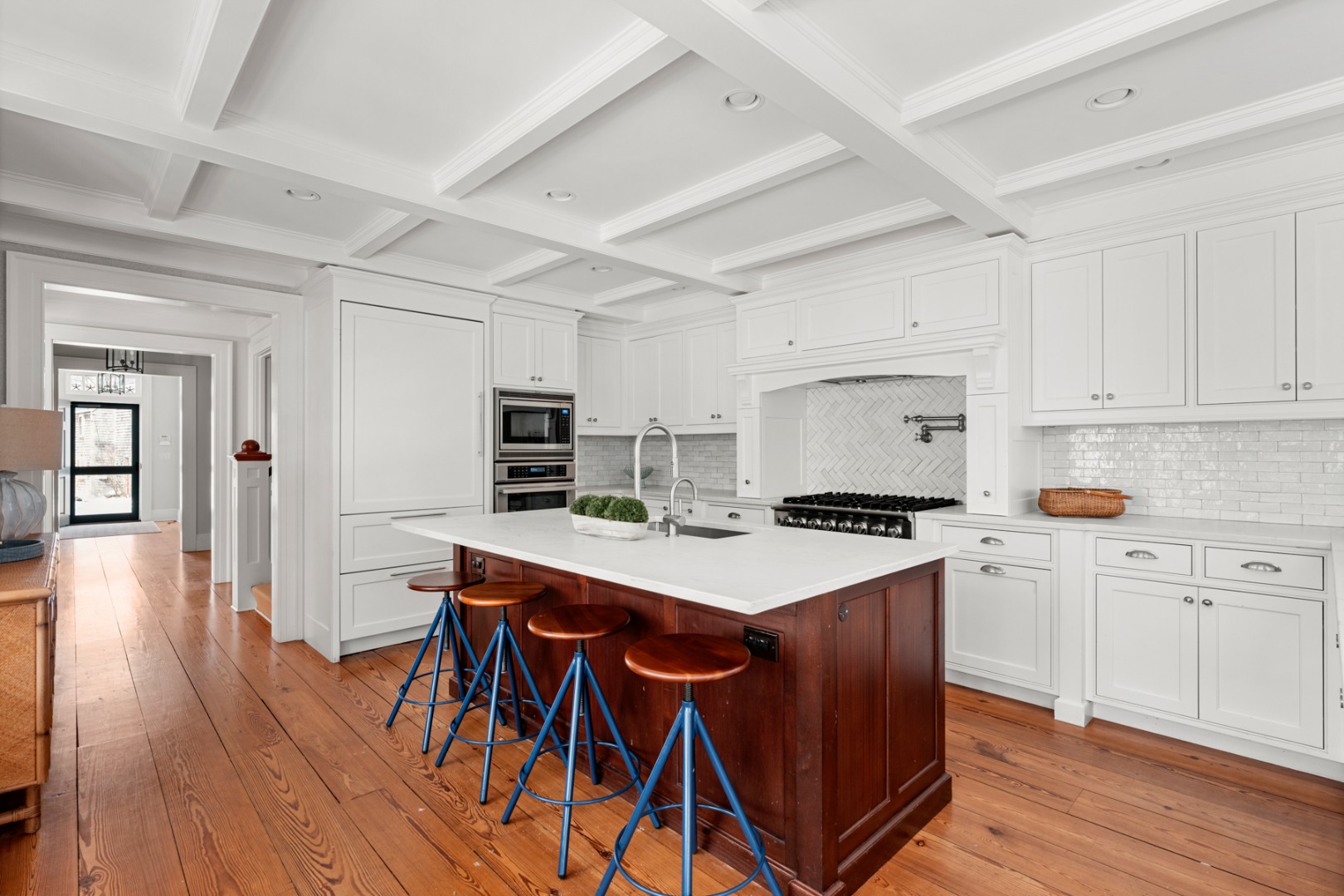 18 Mill Street Nantucket, MA 02554 - Photo 12 of 47 a kitchen with a stove a refrigerator and a dining table with wooden floor