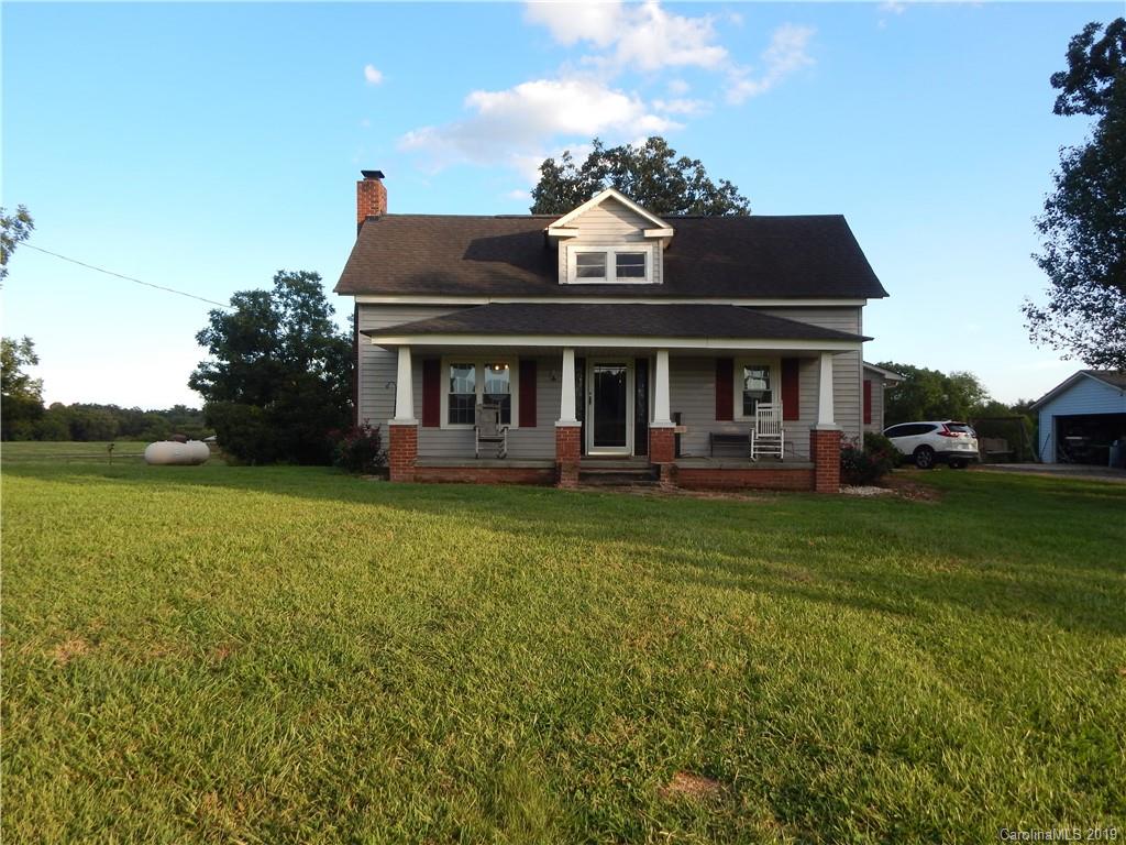 387 Bennett Martin Road Polkton, NC 28135 - Photo 1 of 24 a front view of a house with garden