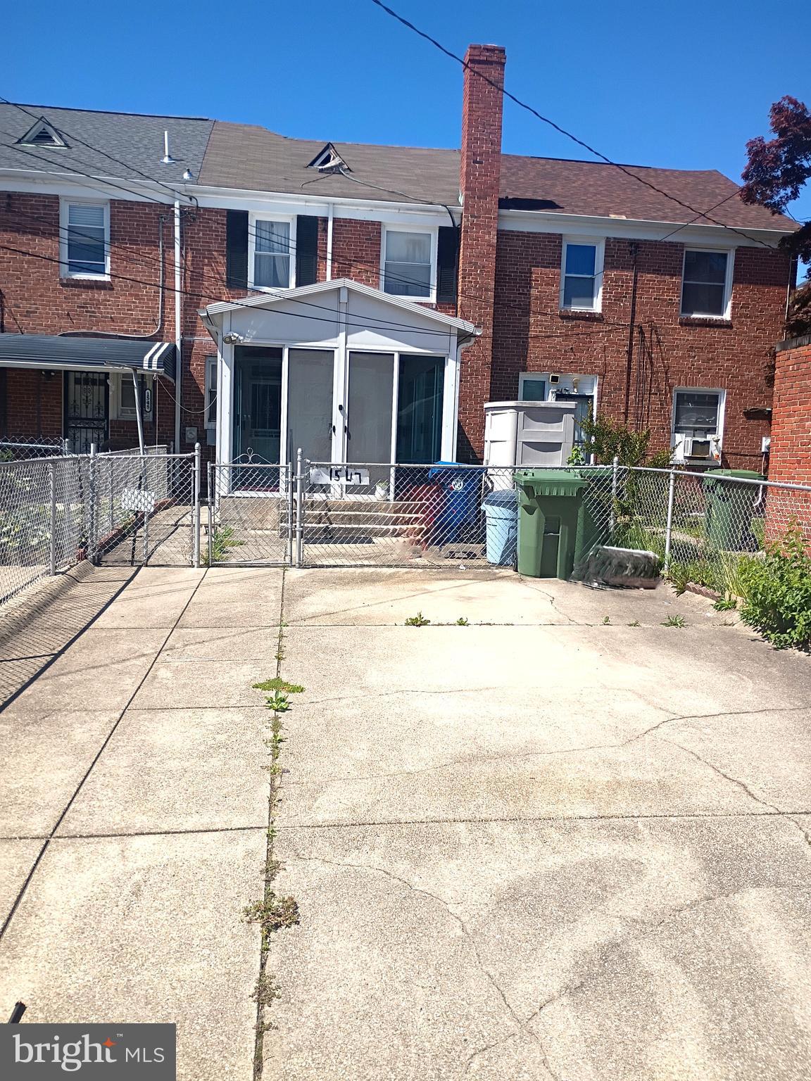 1547 Lochwood Road Baltimore, MD 21218 - Photo 3 of 30 2- car parking pad w/ easy access to Sunroom