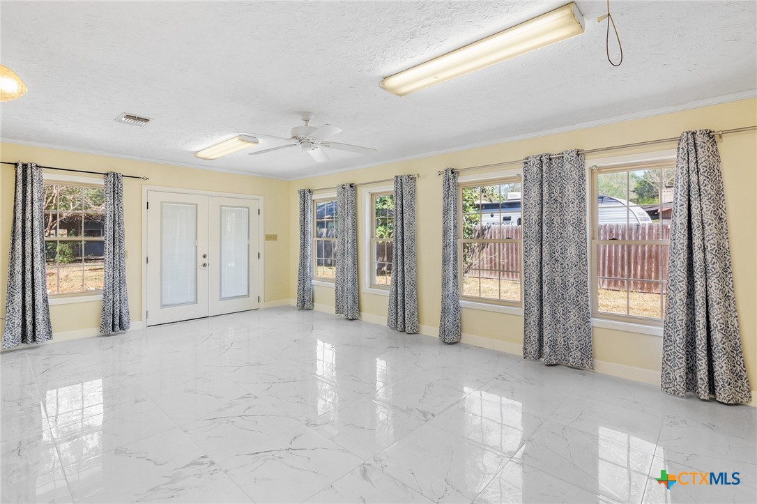 608 Berwick Road Victoria, TX 77904 - Photo 15 of 31 a view of an empty room with glass door