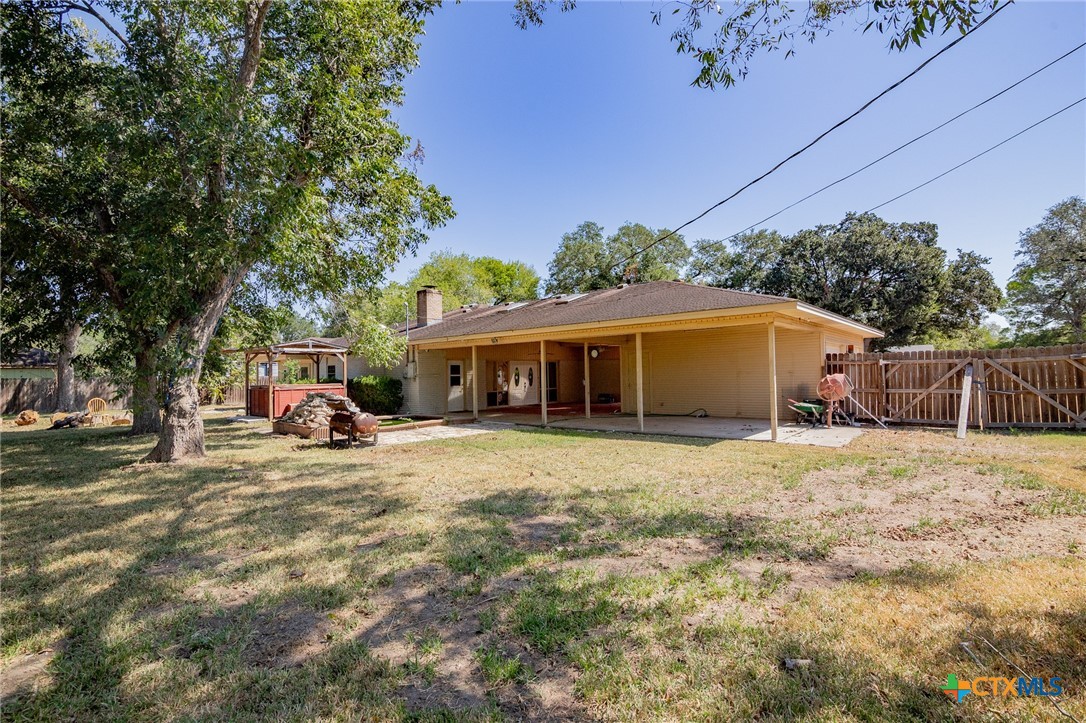 608 Berwick Road Victoria, TX 77904 - Photo 26 of 31 a view of a house with backyard and seating area
