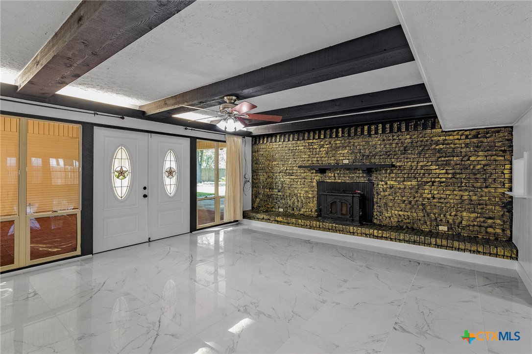 608 Berwick Road Victoria, TX 77904 - Photo 8 of 31 a view of an empty room with a fireplace