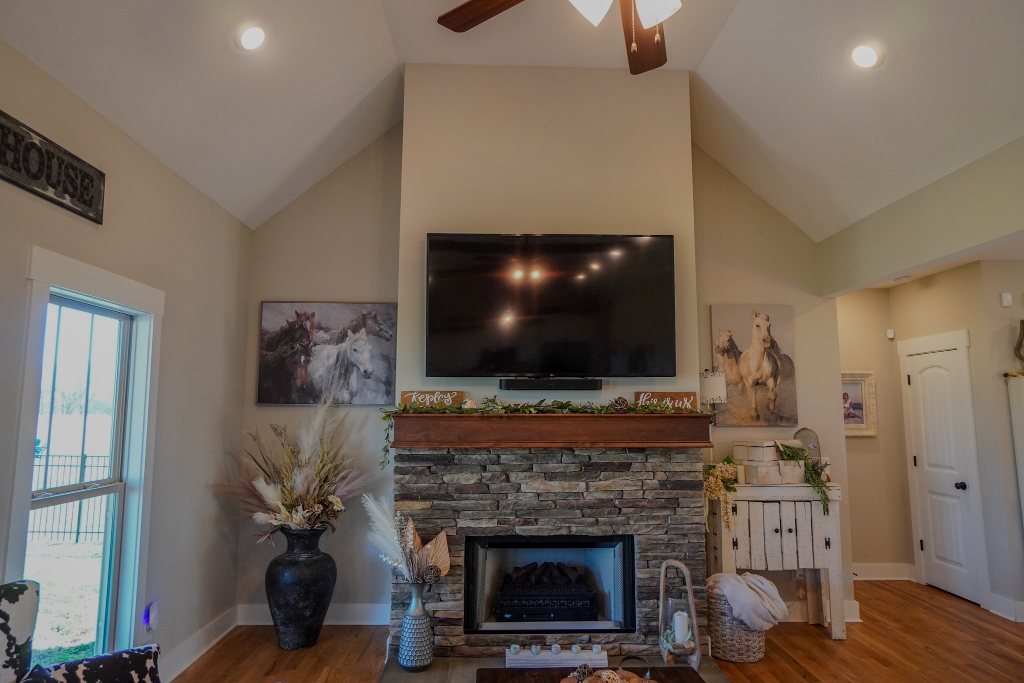 529 Clearview Road Cottontown, TN 37048 - Photo 11 of 64 a living room with furniture a flat screen tv and a fireplace