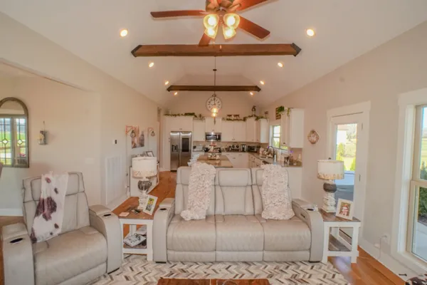a large kitchen with a table and chairs in it