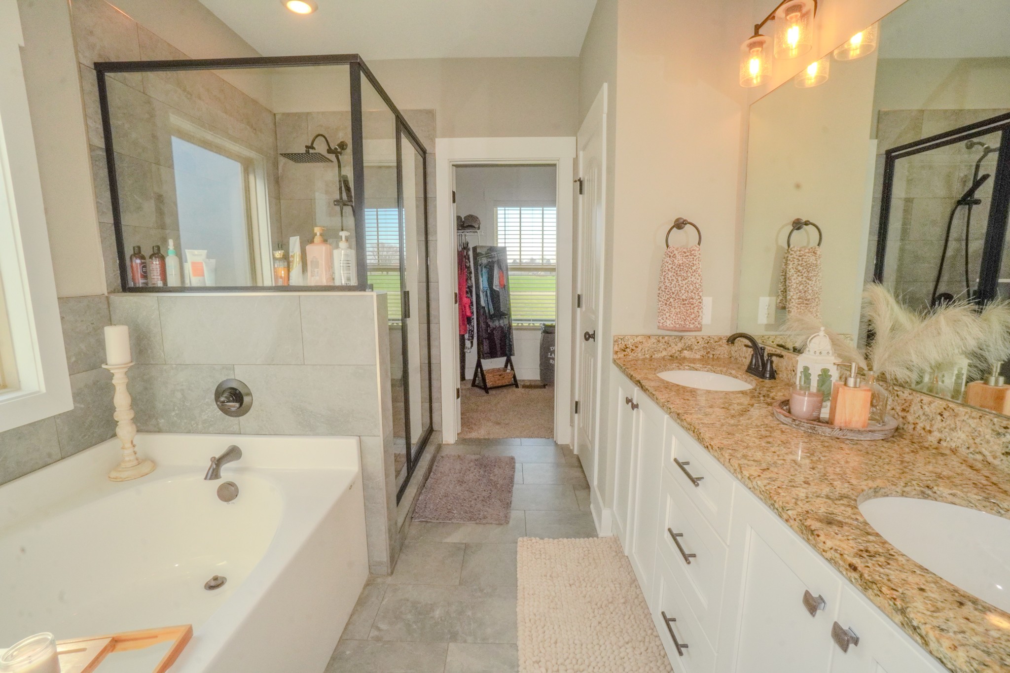 529 Clearview Road Cottontown, TN 37048 - Photo 28 of 64 a bathroom with a granite countertop tub sink and mirror