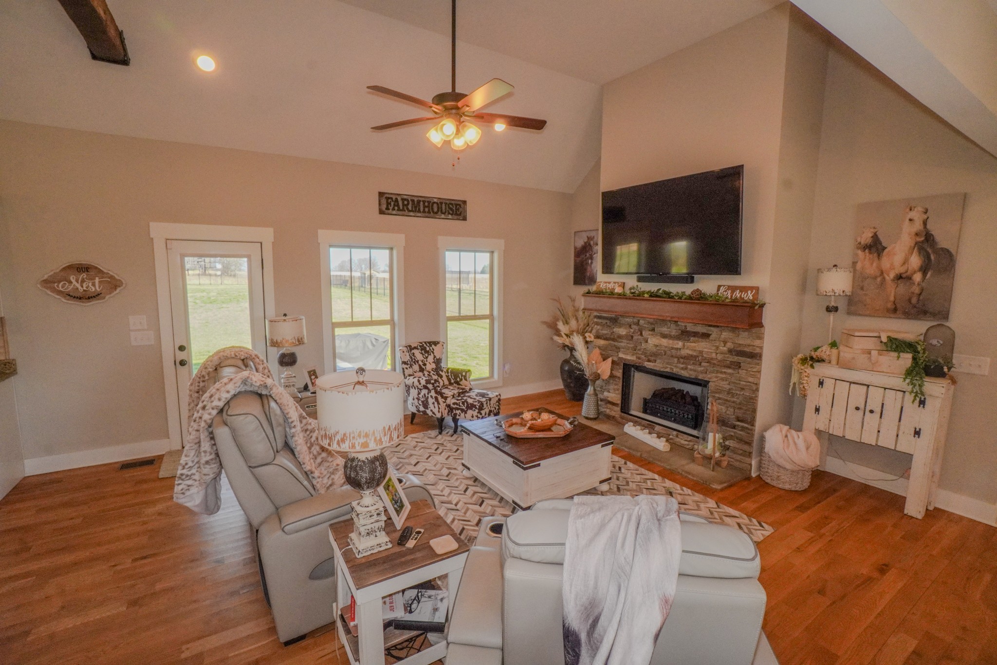529 Clearview Road Cottontown, TN 37048 - Photo 9 of 64 a living room with furniture a flat screen tv and a fireplace