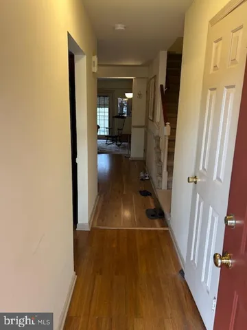 a view of gallery with wooden floor