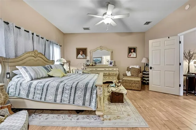 a bed room with a bed and a chandelier