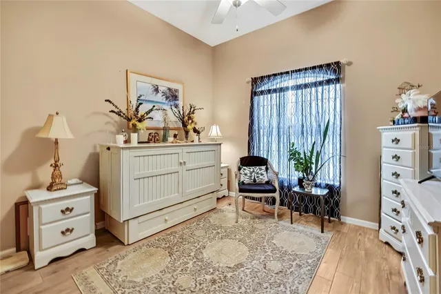 a bed room with a bed and a chair in it