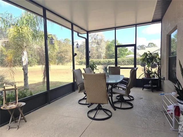 a view of a backyard with swimming pool