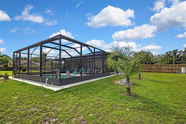 a front view of a house with a yard and balcony